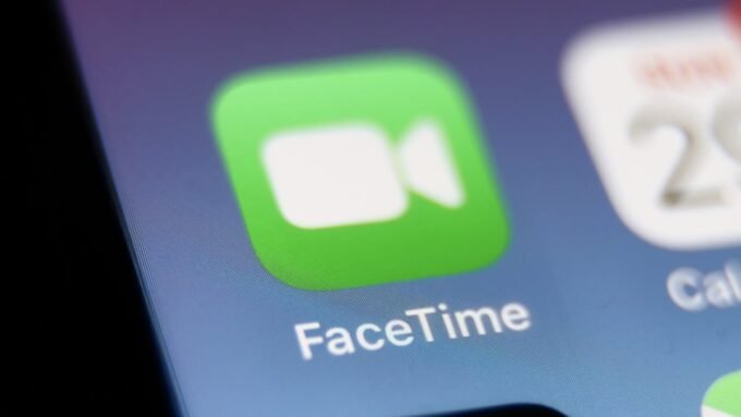 FaceTime Fraud Alert: Scammers Impersonate Apple Support, Empty Bank Accounts 7 Illustration of a person receiving a suspicious FaceTime call from 'Apple Support' with a warning icon.