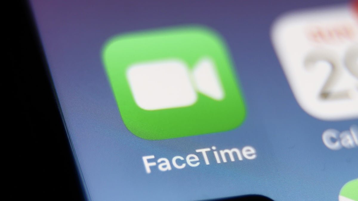 Illustration of a person receiving a suspicious FaceTime call from 'Apple Support' with a warning icon.