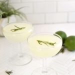 The Timeless Gimlet: A Classic Cocktail Reimagined 6 A perfectly chilled Classic Gimlet cocktail in a coupe glass, garnished with a lime wedge.