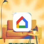 A Google Nest Hub displaying smart home controls, surrounded by other smart devices like a smart bulb and a speaker.