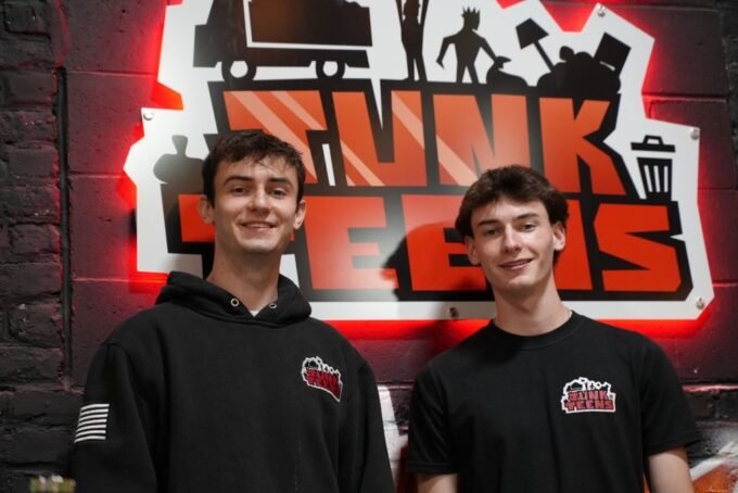Kirk McKinney (left) and Jacob McKinney (right), co-founders of Junk Teens, standing proudly.