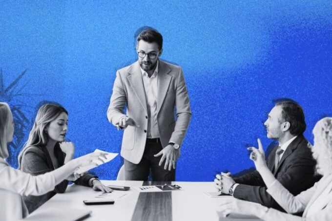 A leader calmly addressing a team during a challenging business period, demonstrating transparent communication and guiding them towards a clear path forward.