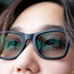 A pair of sleek smart glasses with a subtle glow, symbolizing AI and continuous recording.