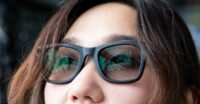 A pair of sleek smart glasses with a subtle glow, symbolizing AI and continuous recording.
