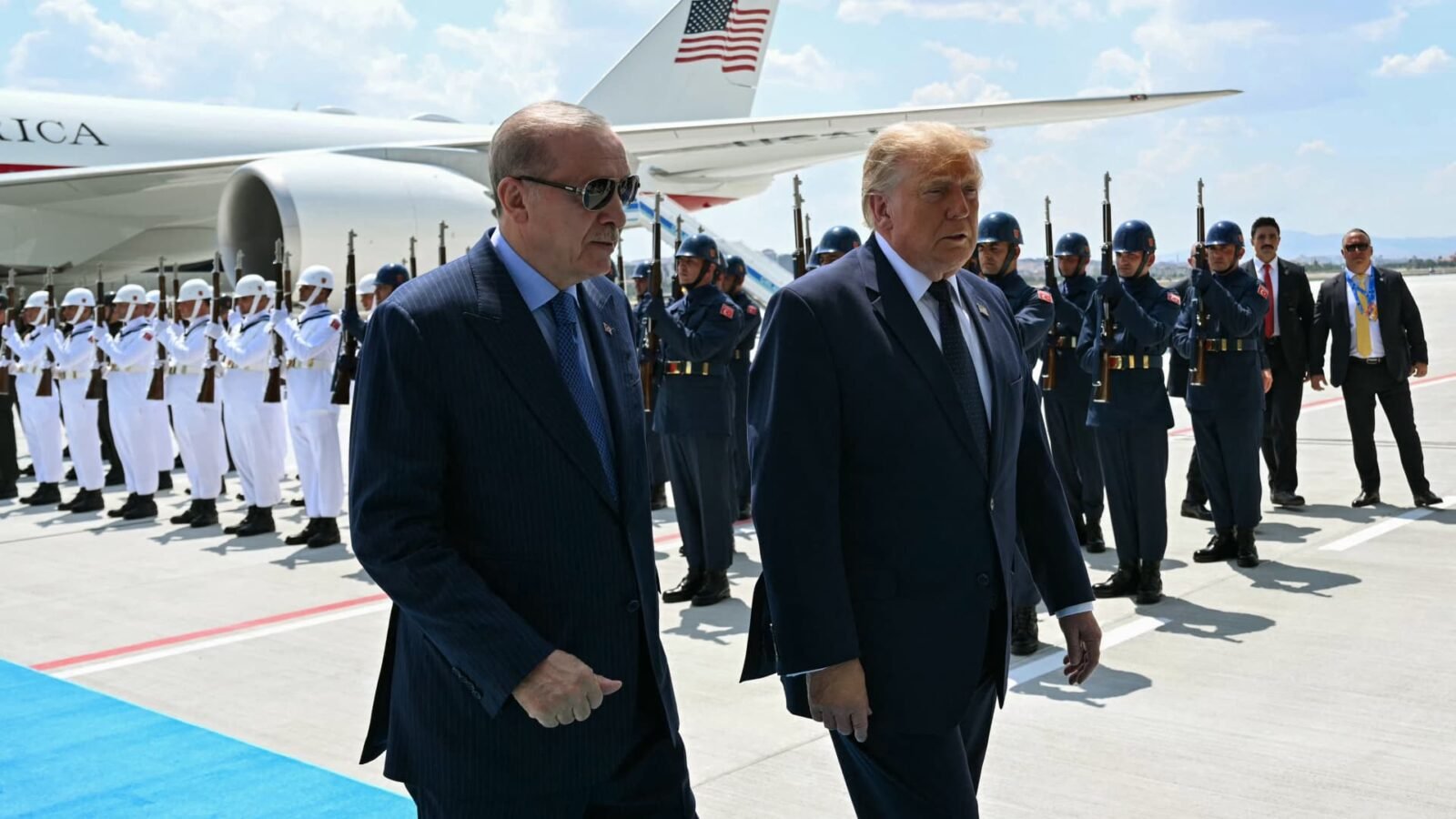 U.S. President Donald Trump is greeted by Turkish President Recep Tayyip Erdogan upon arrival at Etimesgut Air Base for the NATO summit in Ankara.