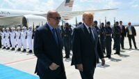 U.S. President Donald Trump is greeted by Turkish President Recep Tayyip Erdogan upon arrival at Etimesgut Air Base for the NATO summit in Ankara.