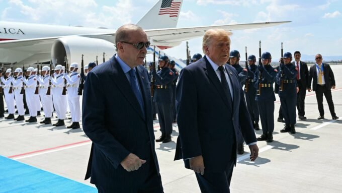 U.S. President Donald Trump is greeted by Turkish President Recep Tayyip Erdogan upon arrival at Etimesgut Air Base for the NATO summit in Ankara.