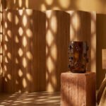 A collection of sculptural Nywele Vases in various earthy tones, inspired by Bantu knots.