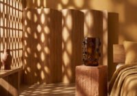 A collection of sculptural Nywele Vases in various earthy tones, inspired by Bantu knots.