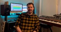 Oli Freke, synth historian and author of Beat Gems, with a drum machine or bicycle