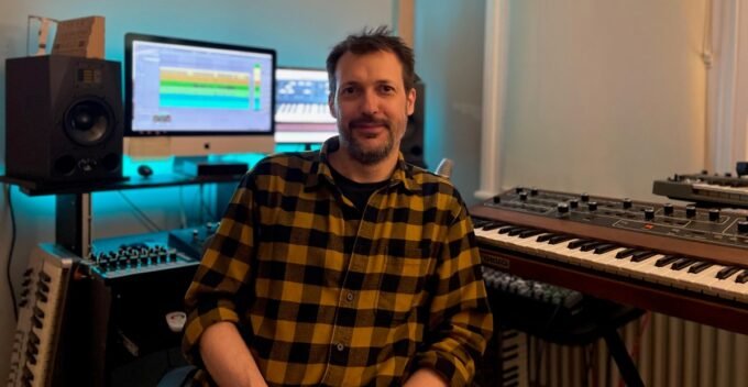 Oli Freke, synth historian and author of Beat Gems, with a drum machine or bicycle