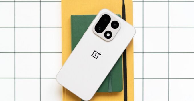 OnePlus smartphone with The Verge logo, symbolizing the brand's presence in the US and Europe.