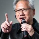 Nvidia CEO Jensen Huang delivering a keynote speech, with a futuristic AI-themed background, emphasizing the importance of open-weight AI models.