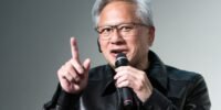 Nvidia CEO Jensen Huang delivering a keynote speech, with a futuristic AI-themed background, emphasizing the importance of open-weight AI models.