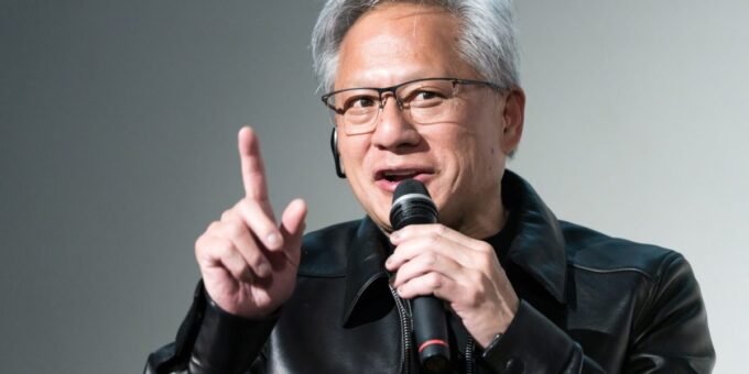 Jensen Huang's Urgent AI Warning: Don't Repeat the 1980s Software Blunder 9 Nvidia CEO Jensen Huang delivering a keynote speech, with a futuristic AI-themed background, emphasizing the importance of open-weight AI models.