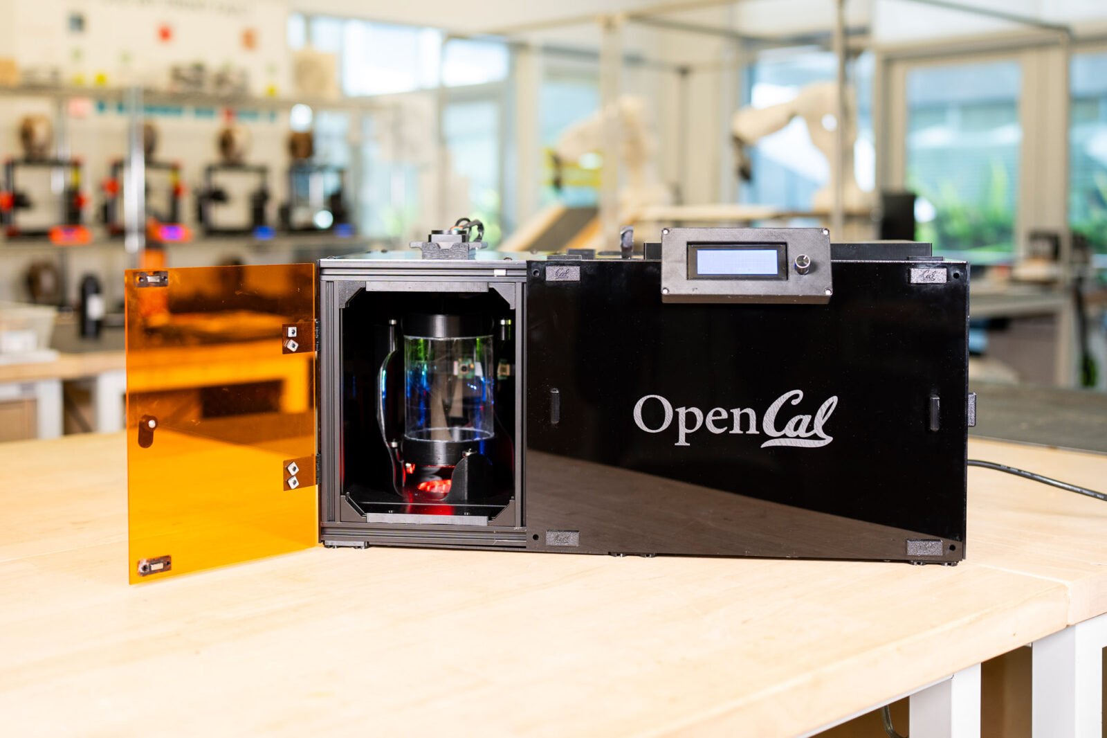 OpenCAL: The DIY Revolution in Layerless 3D Printing 3 An OpenCAL layerless 3D printer in operation, showing an object forming rapidly within a resin vial.