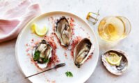Close-up of fresh oysters on a bed of ice, symbolizing their potential health benefits for gut inflammation.
