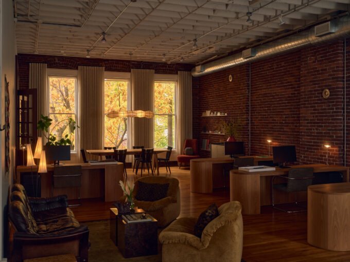 The Evolving Canvas: Pat Austin's Portland Studio Redefines Design Philosophy 9 Interior of Pat Austin's Portland studio, showcasing custom maple desks, vintage furniture, and a residential-style lounge within the Historic Cully Building.