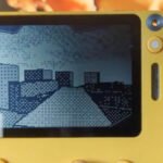 Screenshot of a 3D platforming game demo running on a yellow Playdate handheld console
