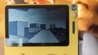 Screenshot of a 3D platforming game demo running on a yellow Playdate handheld console