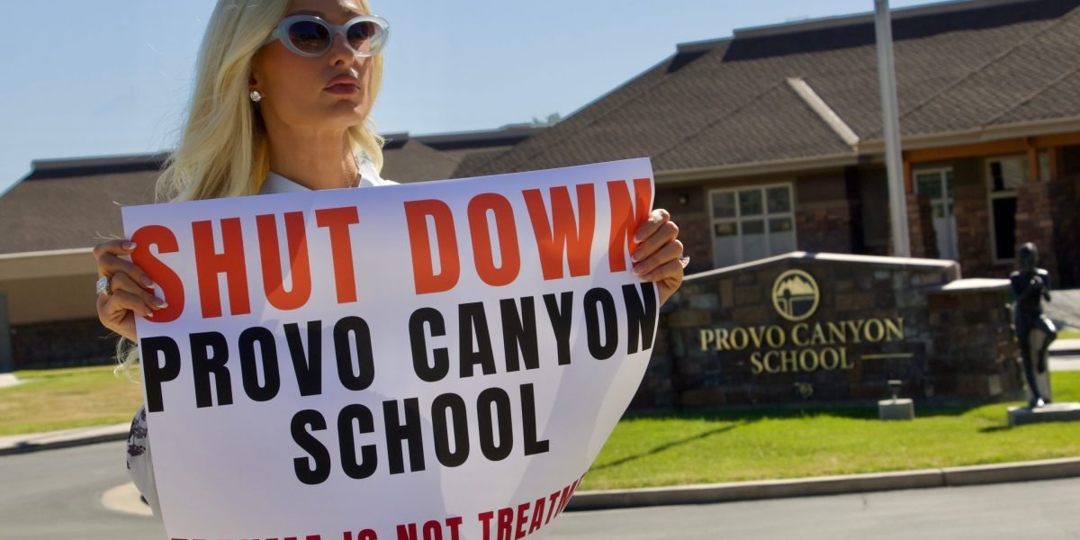 Paris Hilton speaking out against the troubled teen industry, with Provo Canyon School in the background.