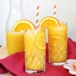 The Perfect Screwdriver: A Timeless Vodka & Orange Juice Cocktail Guide 3 A refreshing Screwdriver cocktail in a tall glass, garnished with an orange slice, on a bright background.