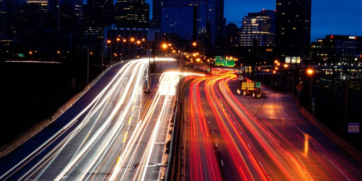Cars on a highway, with a speedometer highlighting the minimal time saved versus fuel consumed by speeding.