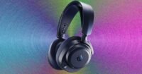 SteelSeries Arctis Nova Pro Omni gaming headset with its USB hub on a desk.