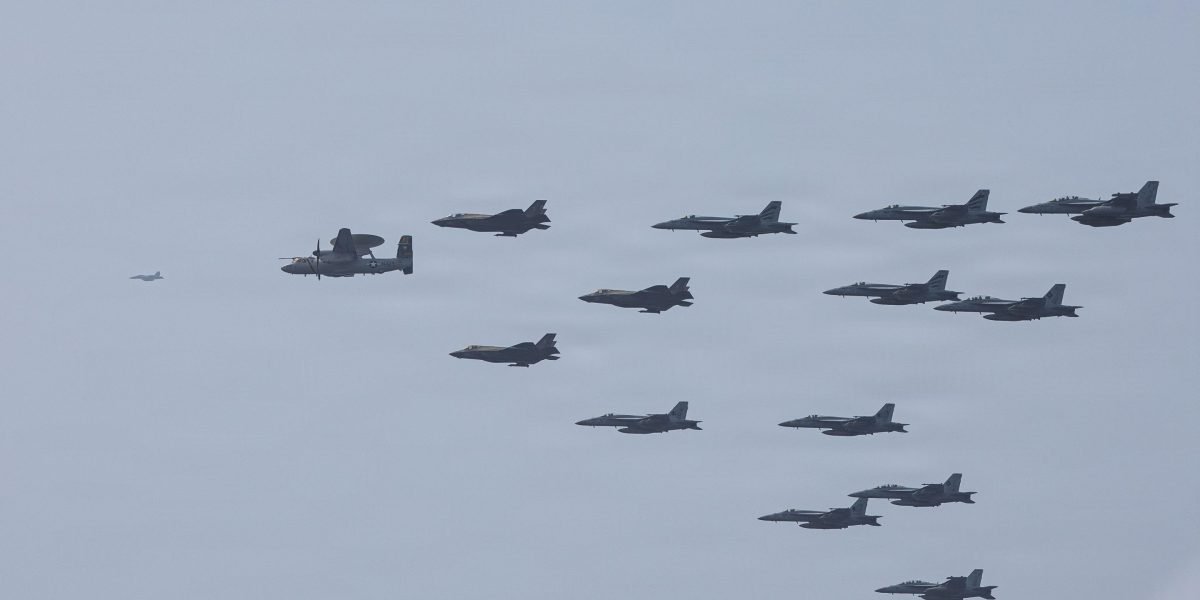 Strait of Hormuz on Brink: US-Iran 'Ceasefire Facade' Shatters Amid Escalating Naval Clashes 3 U.S. Navy warships patrolling the Strait of Hormuz amidst escalating tensions with Iran, with a commercial oil tanker in the background.
