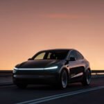 A Tesla vehicle operating as a robotaxi on a street in Miami, showcasing autonomous driving technology.