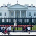 Illustration of the White House with Bitcoin symbols, representing the U.S. federal crypto reserve.