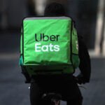 Uber logo displayed on a smartphone screen, symbolizing its European operations.