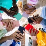 UK Unveils Sweeping Social Media Curfew and Ban for Teens Amidst Online Safety Push 5 A stylized image depicting a clock face overlaid with social media app icons, suggesting time limits or a curfew on digital platforms for young people.