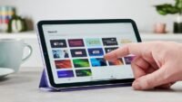A sleek, redesigned Apple iPad mini, possibly submerged slightly in water, showcasing its new water-resistant capabilities.