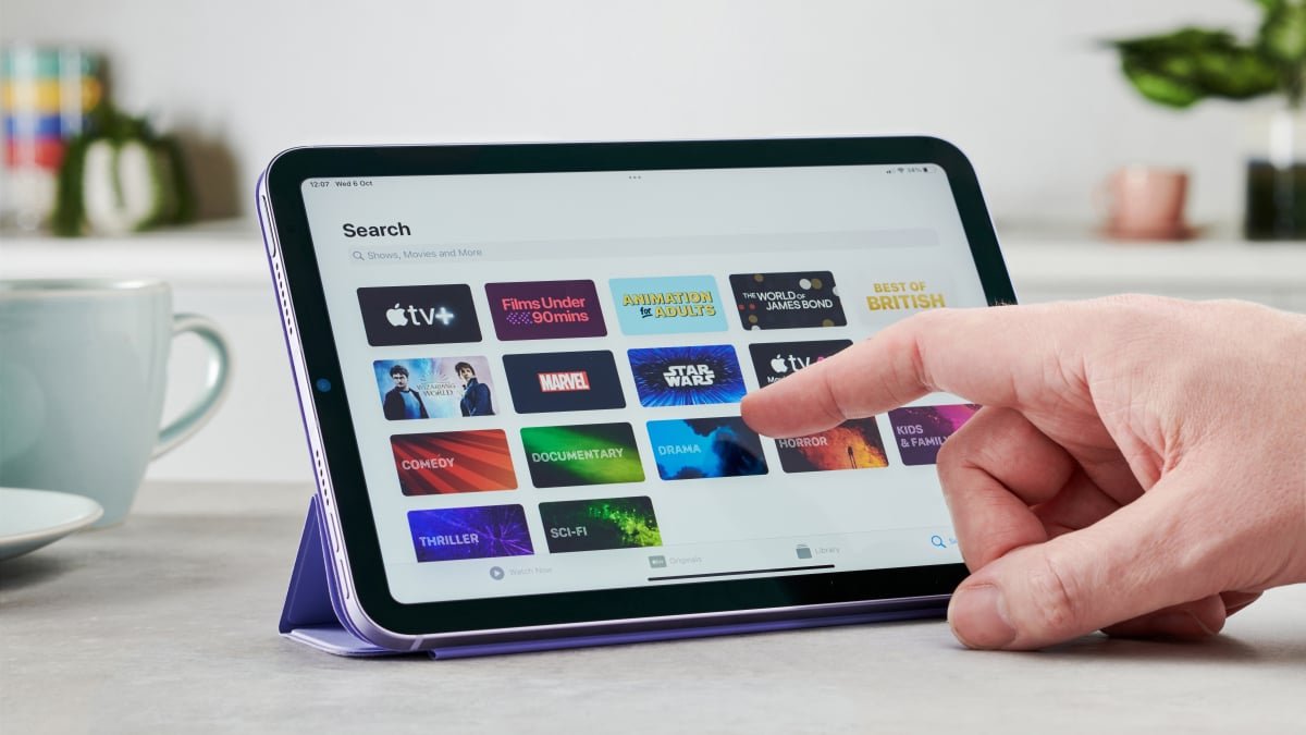 A sleek, redesigned Apple iPad mini, possibly submerged slightly in water, showcasing its new water-resistant capabilities.