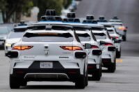 Waymo autonomous vehicle operating on a San Francisco street during daylight hours.