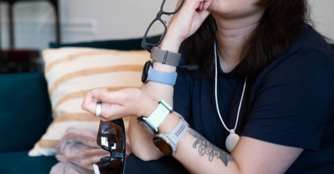 Inside the Wearable Wonderland: A Journalist's Extreme Self-Quantification 9 A collection of advanced wearable health technology devices, including smartwatches, rings, and scales, laid out for review.