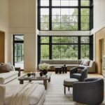 A sophisticated living room in a Wellesley home, featuring neutral tones, natural textures, and a blend of modern and traditional elements.
