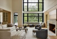A sophisticated living room in a Wellesley home, featuring neutral tones, natural textures, and a blend of modern and traditional elements.