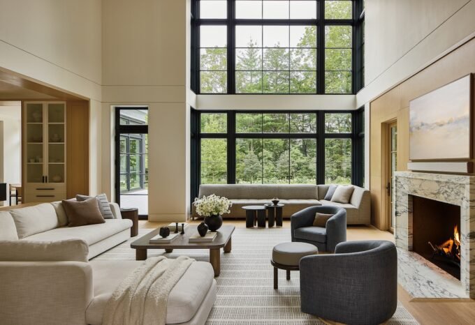 Wellesley's Enduring Elegance: A Family Home Redefining Quiet Luxury 9 A sophisticated living room in a Wellesley home, featuring neutral tones, natural textures, and a blend of modern and traditional elements.