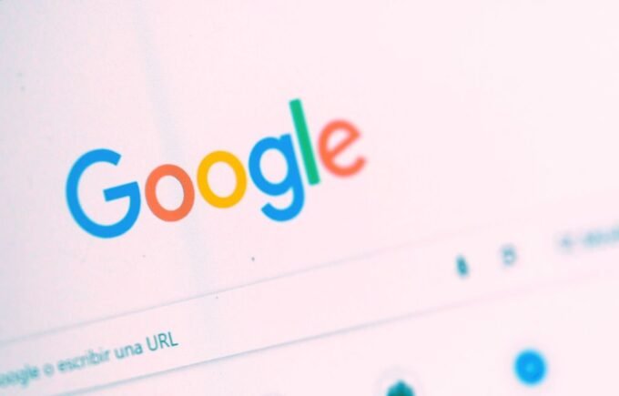 A stylized representation of Google's AI Overviews, showing an AI-generated answer box with embedded links and a magnifying glass icon, symbolizing the future of search.