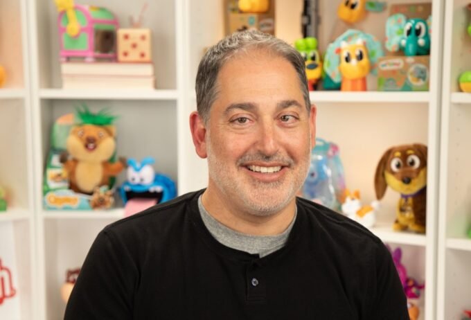 The Click Heard 'Round the World: How Clickeez Went from Idea to 100 Million Sales 9 A collection of colorful Clickeez toys resembling mechanical keyboard keys, some stacked and others on a keychain, showcasing their collectible and customizable nature.