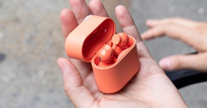 CMF Clip Pro open-ear earbuds with charging case, highlighting their comfortable, secure design.