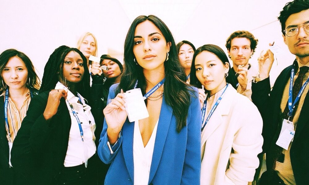 Attendees networking at an event, clearly displaying their custom event badges.