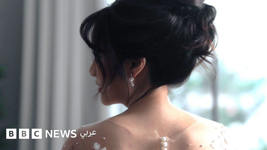 صورة لوانغ تشوانغ مع زوجته السابقة في يوم زفافهما، تظهر جانباً من عمليات الاحتيال الزوجي في الصين.