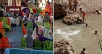 منظر طبيعي لواحة كفايت الخضراء في إقليم جرادة بعد الأمطار الغزيرة، يظهر الجبال والبساتين ومجاري المياه.