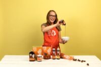 Colleen Sundlie, founder of Date Lady, smiling with her organic date products.