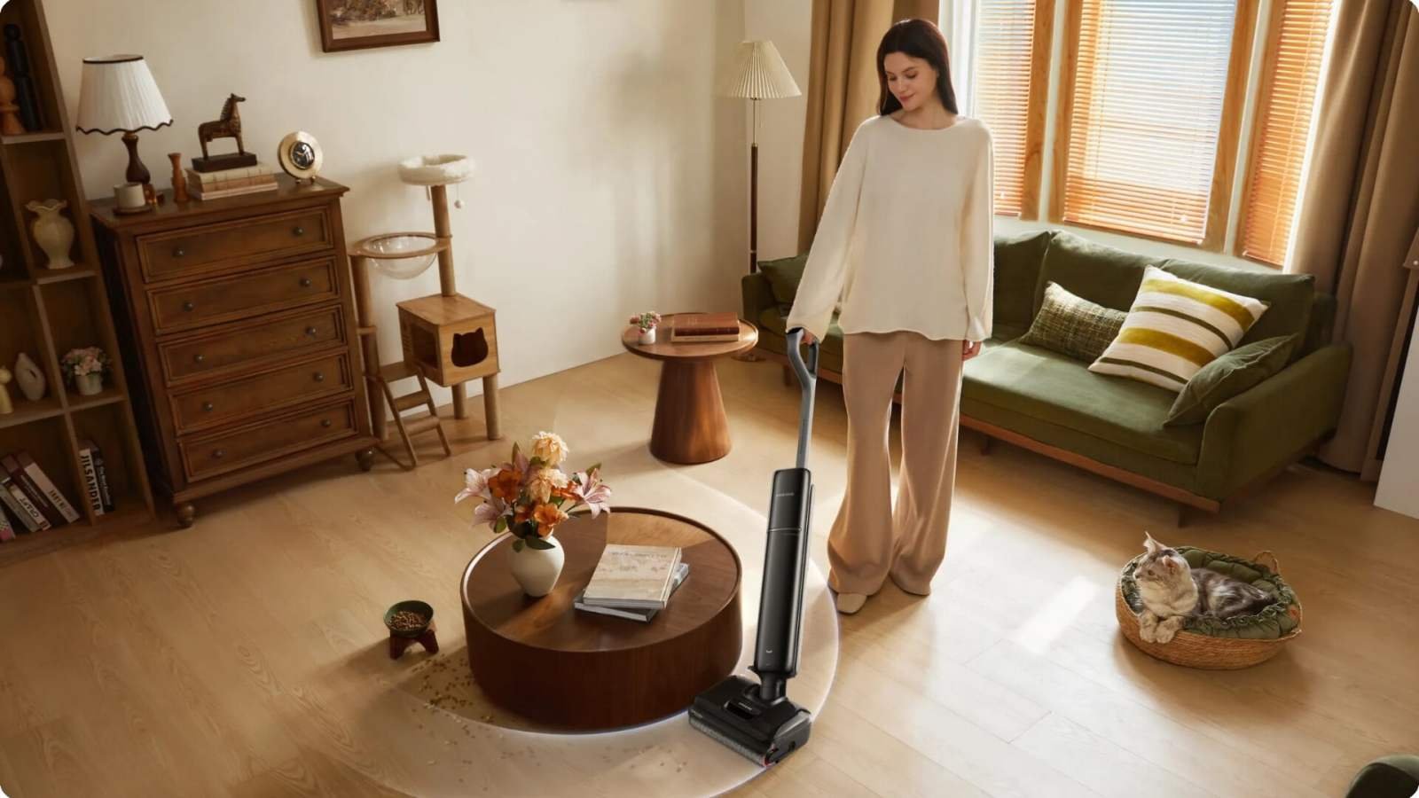 Aspirateur balai laveur Dreame T12 Pro en action, avec son manche incliné sous un meuble bas, illustrant sa finesse et sa maniabilité.