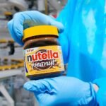 Ferrero's Sweet Ambition: How Nutella's Empire is Conquering the US Snack Market 6 Nutella jar alongside various snack products, symbolizing Ferrero's expansion into the US snack market