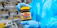 Nutella jar alongside various snack products, symbolizing Ferrero's expansion into the US snack market